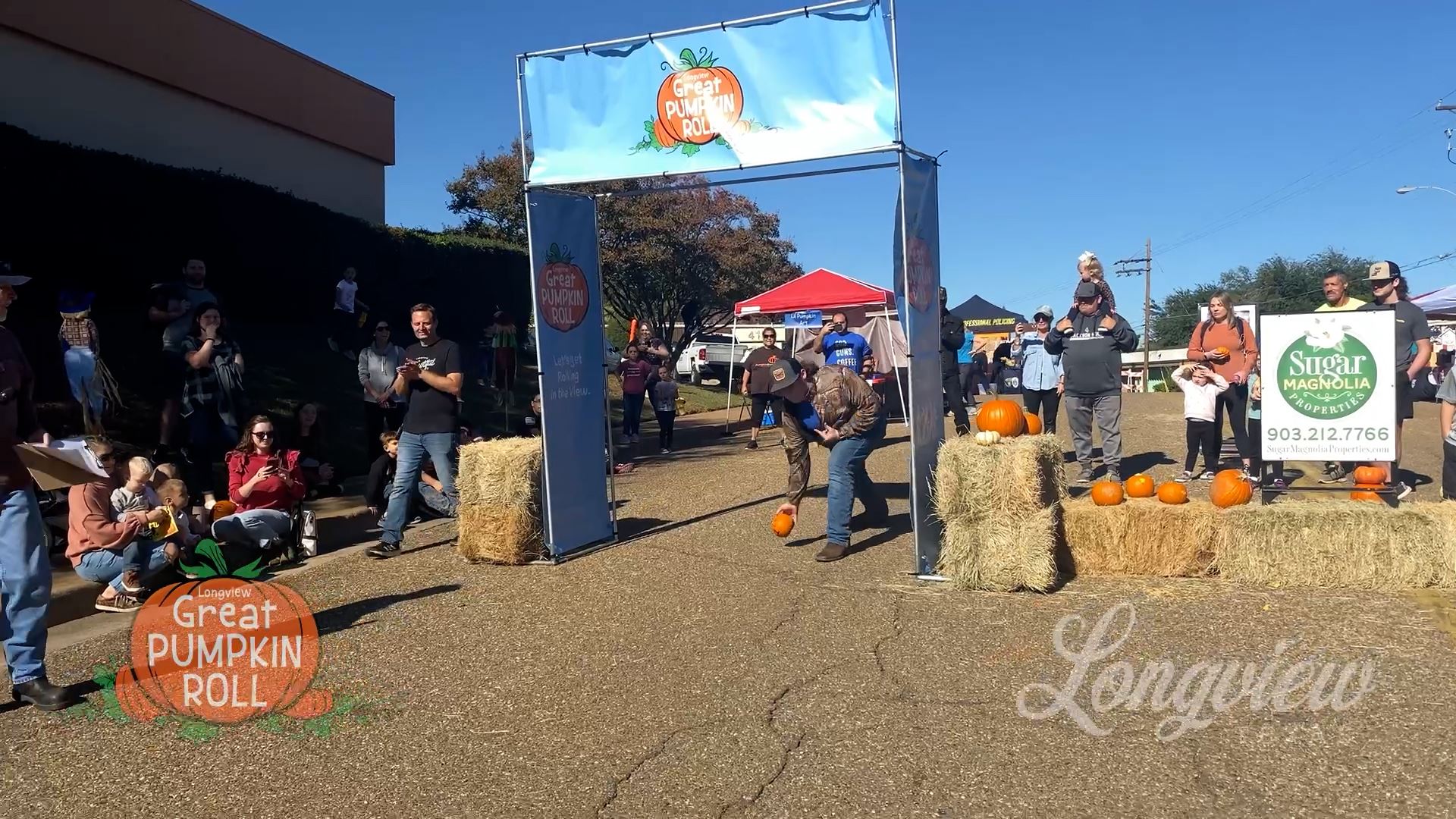 Picture of man rolling pumpkin