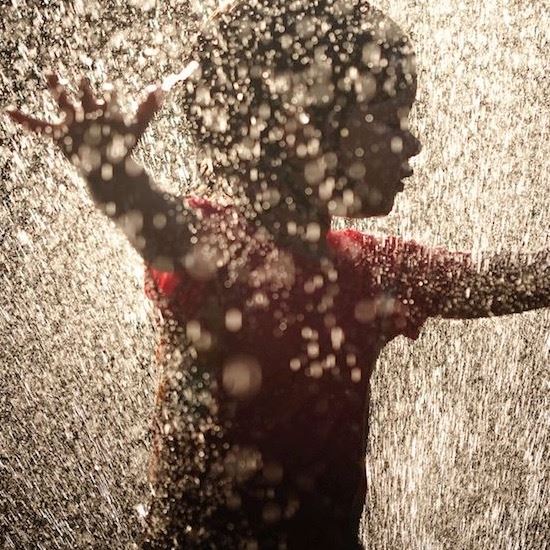 Child plays in the water at Longview splash pad