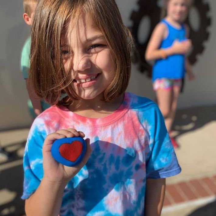 Little girl with clay