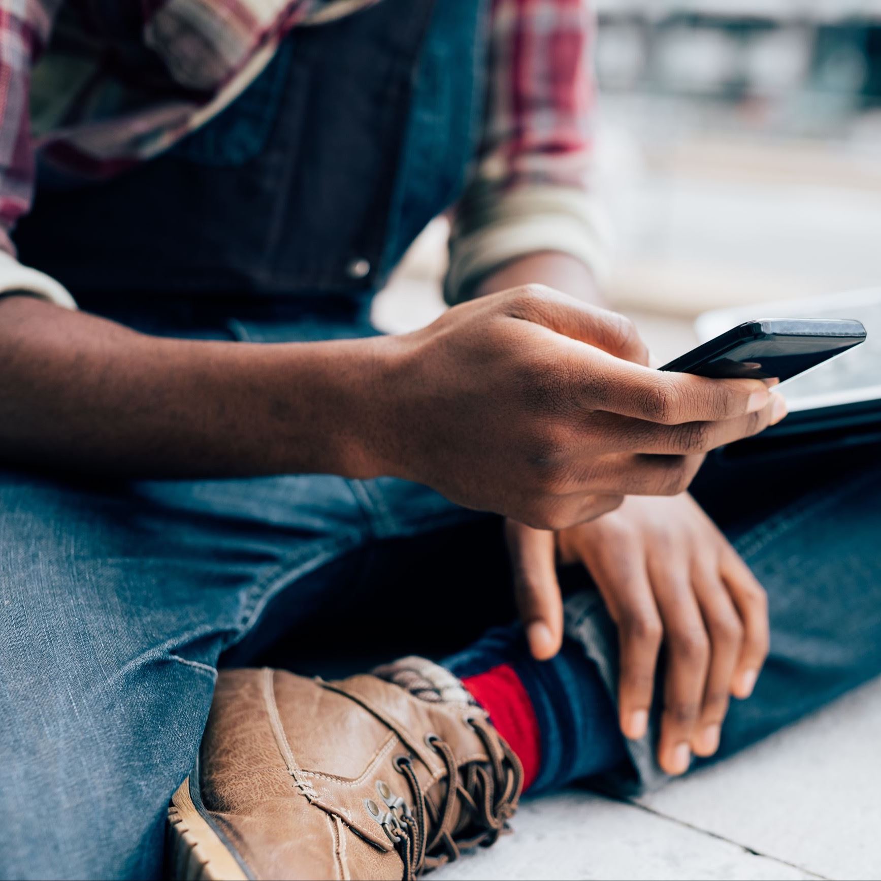 a guy texting on cell phone