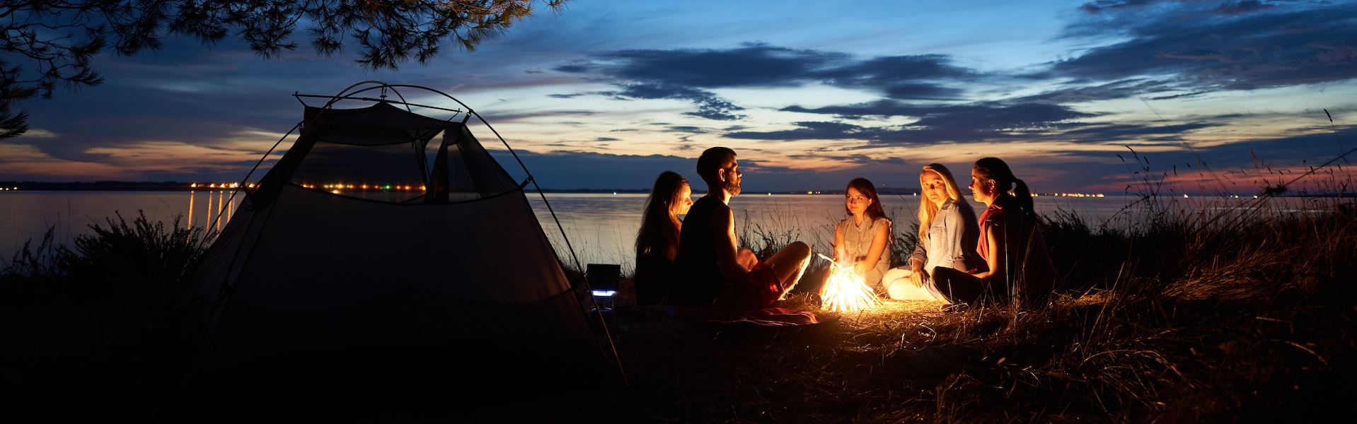 Family around campfire at campground
