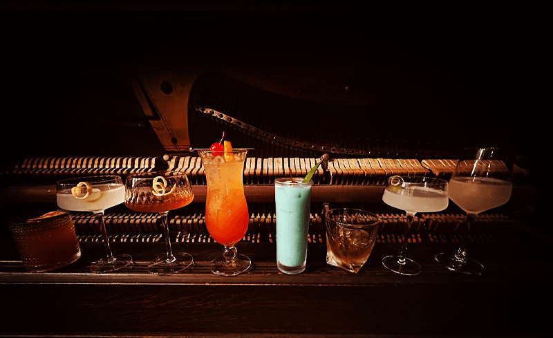 Photo - cocktails on a paino keyboard