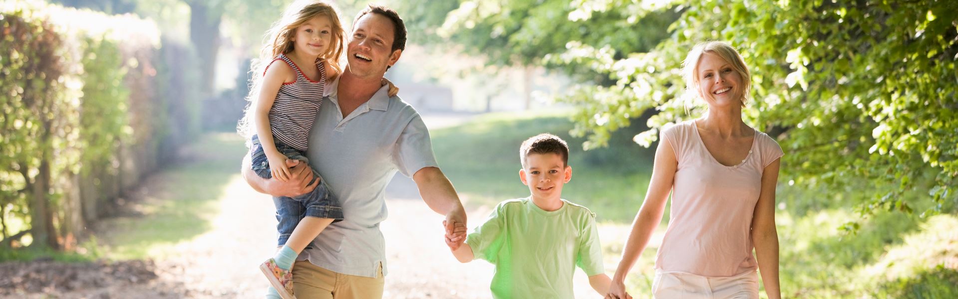 Family walking in the sunshine