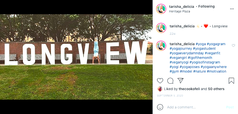 Girl in handstand at Longview Letters sign at Heritage Plaza, Longview, TX