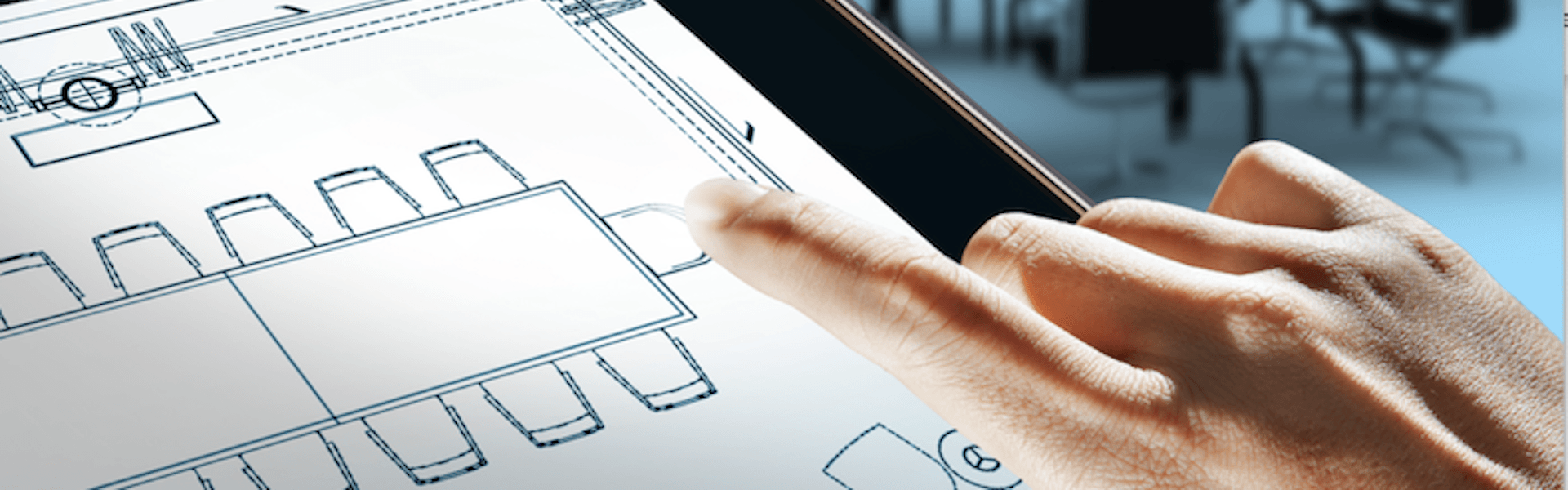 hands holding iPad looking at meeting rooms